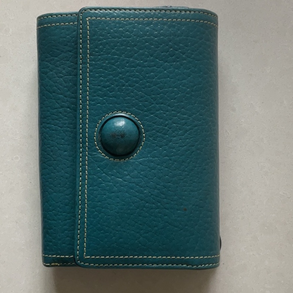 TUSK tri-fold wallet.  Teal blue color, red lining, leather.